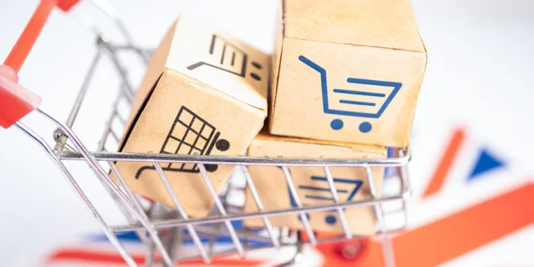 Box with shopping online cart logo and United Kingdom flag