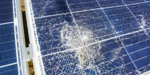Broken destroyed cracked hole in solar panel