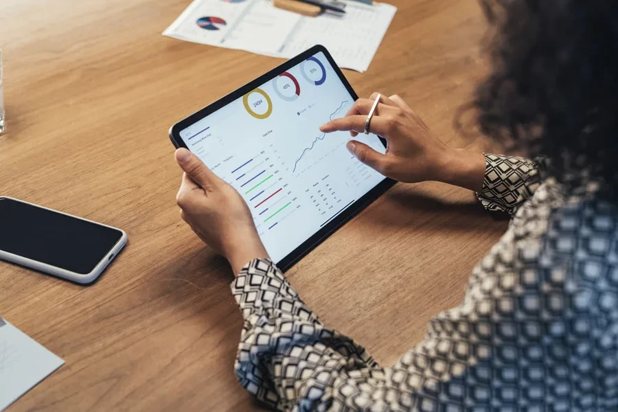 Businesswoman analyzing data on a tablet