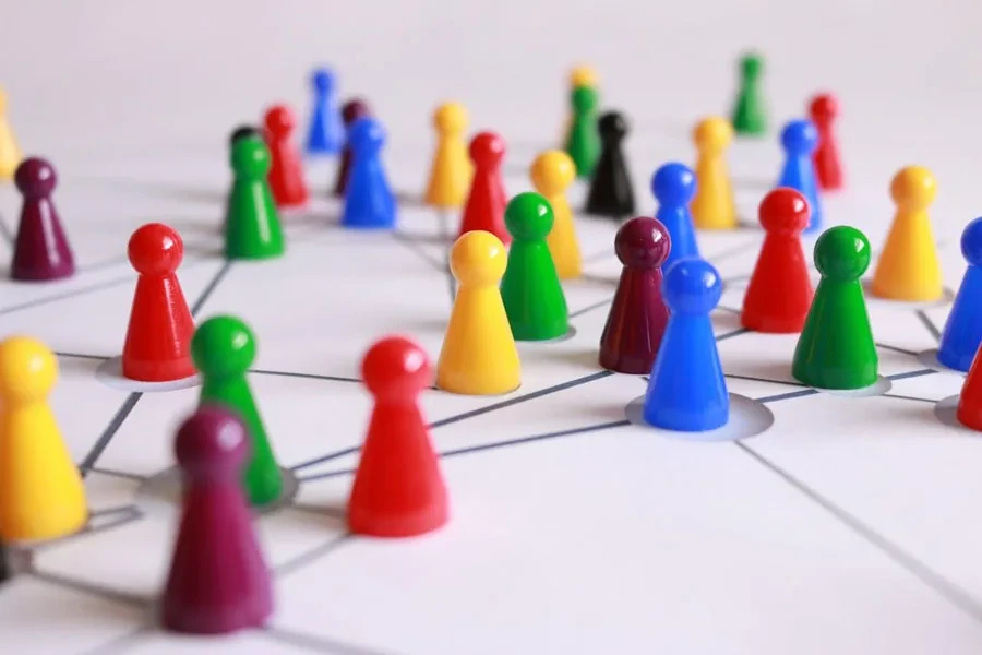 Colorful game pieces connected to represent networking