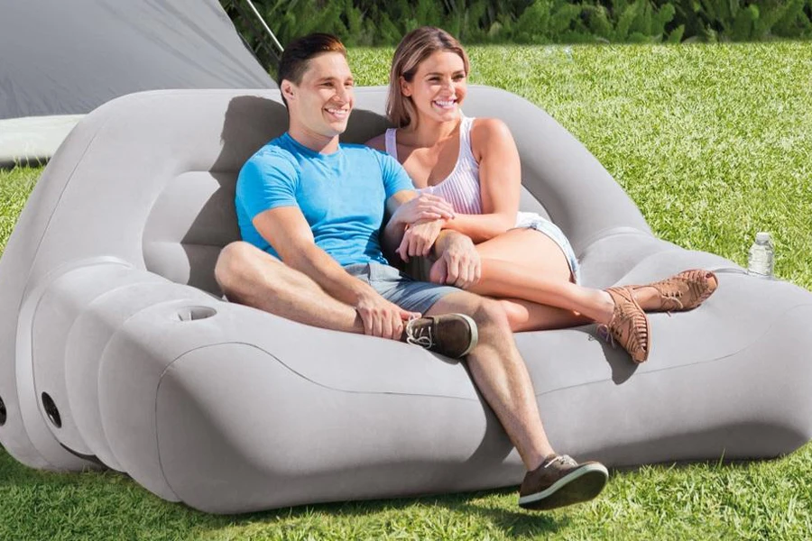 Couple sitting on a large air sofa