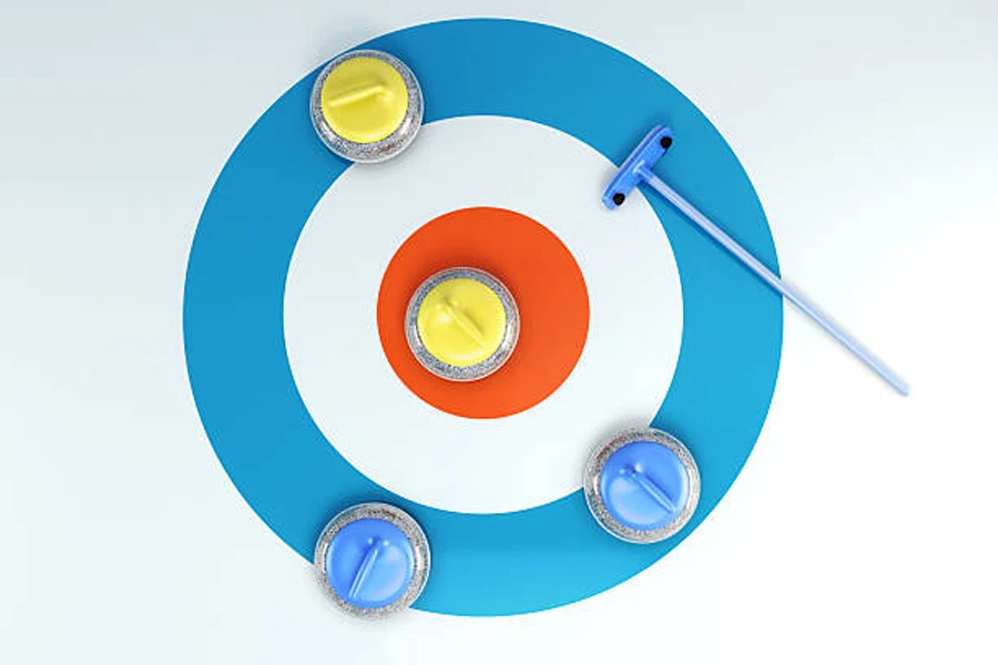 Cercle de curling avec quatre pierres et une brosse sur le dessus