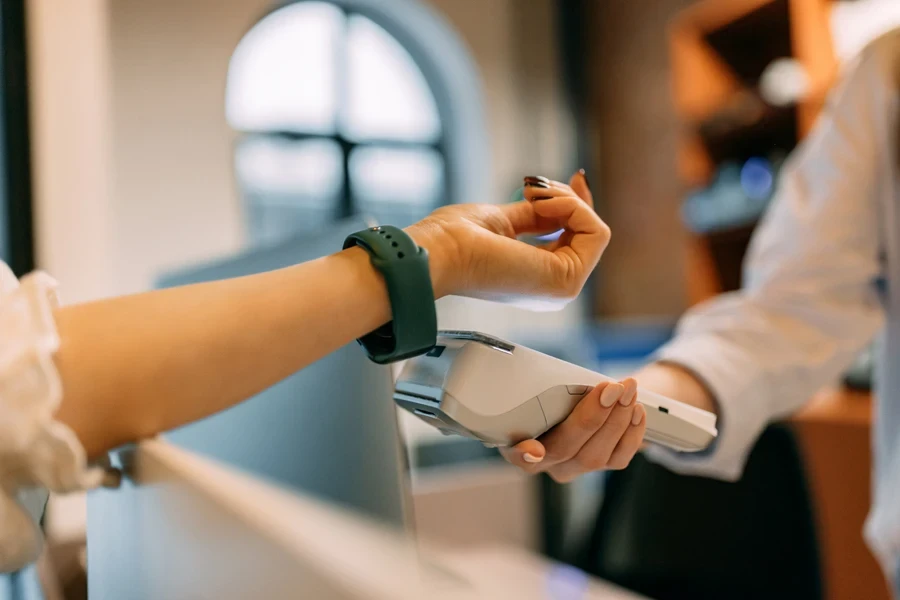 Customer using a smartwatch to make a payment