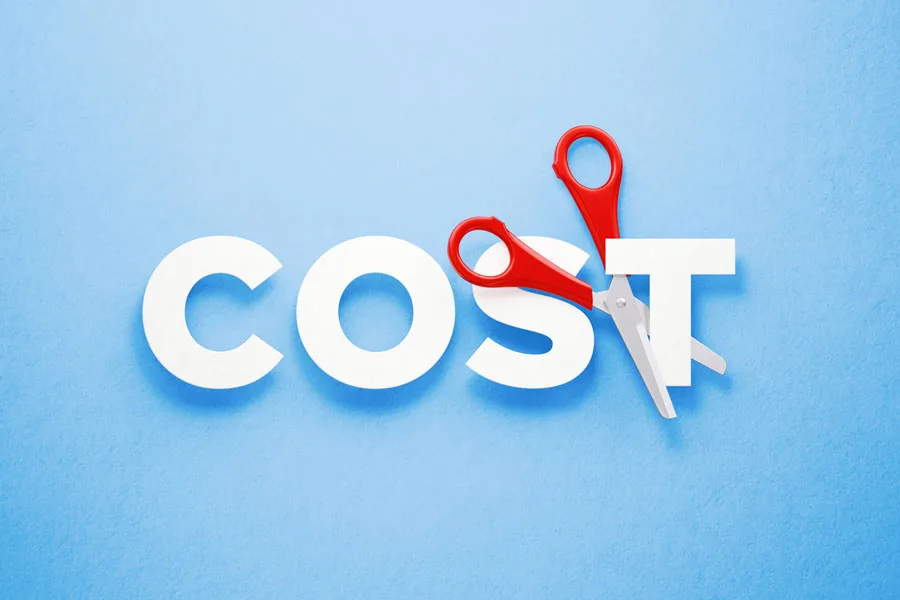 Cutting the word “COST” using a pair of scissors