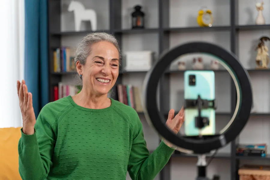 Elderly woman making a social media video