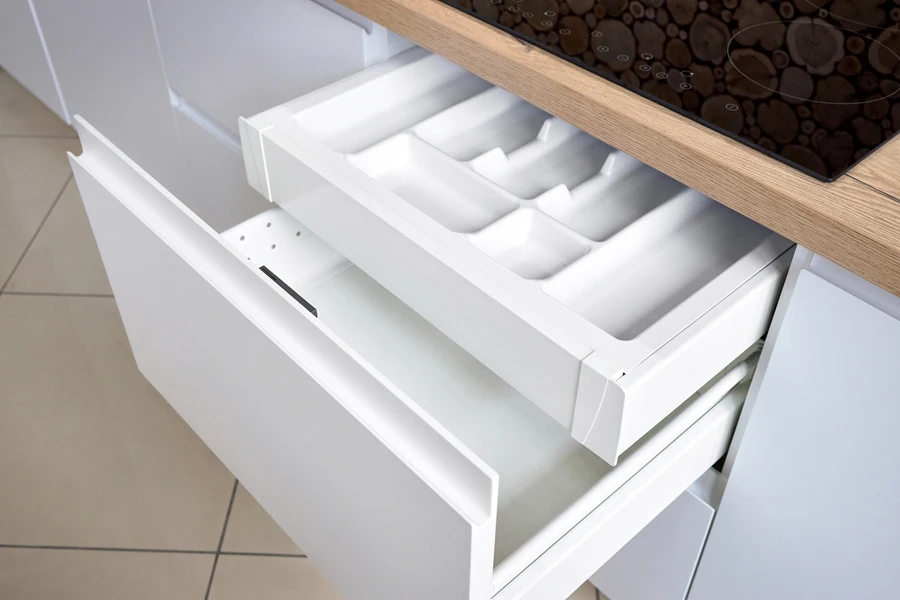 Empty white kitchen pull-out drawer