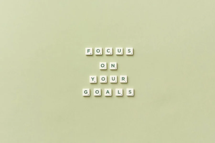 FOCUS ON YOUR GOALS spelled out in Scrabble tiles