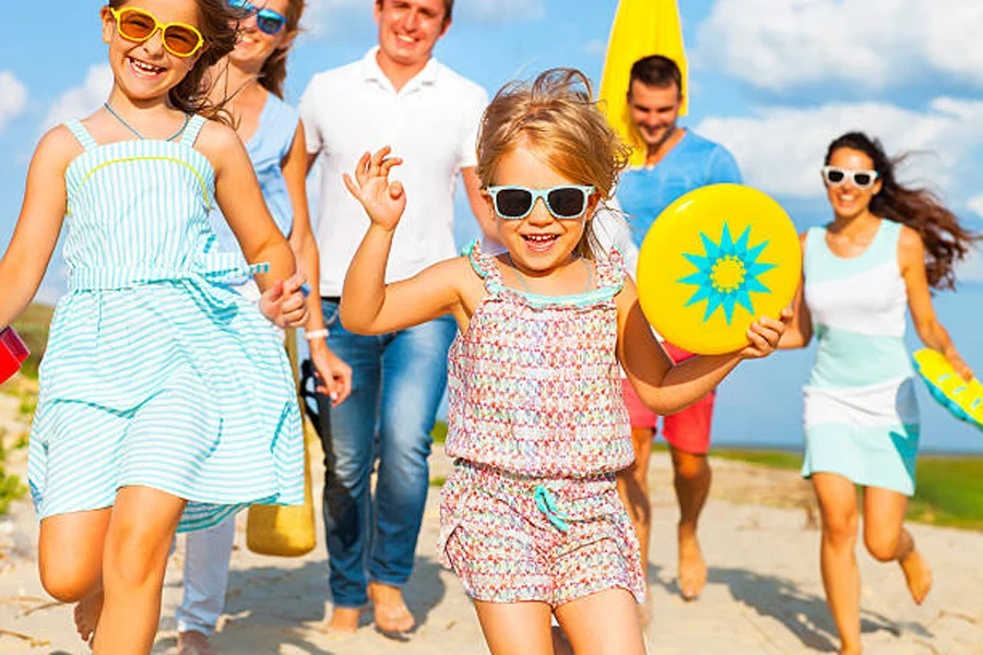 Family going to the beach with a beach frisbee