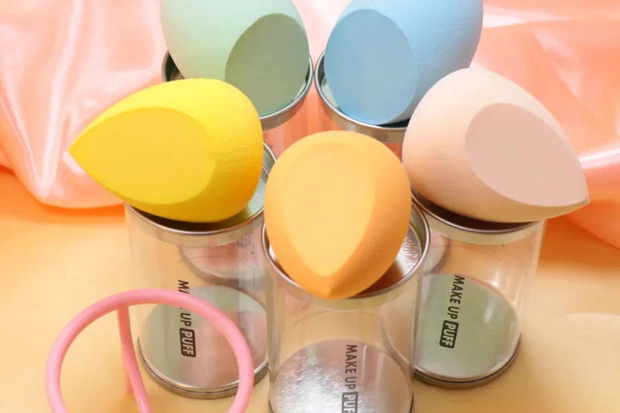 Five multicolor teardrop cosmetic puffs