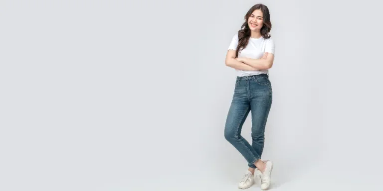 Full length of confident Asian woman smiling in a casual outfit