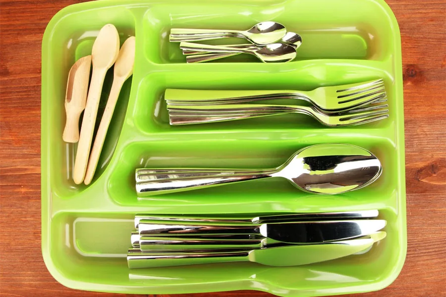 Green cutlery tray with cutlery