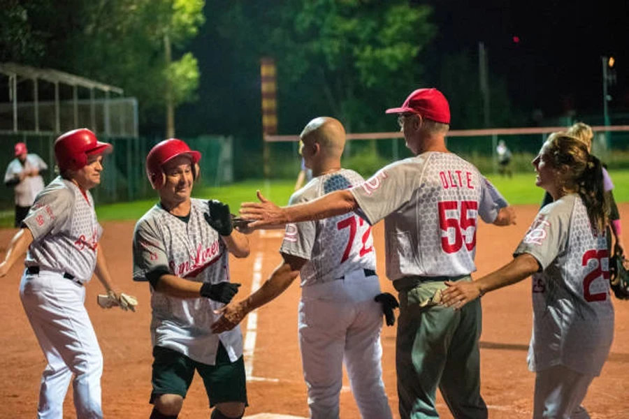 Group of people high-fiving during a softball match