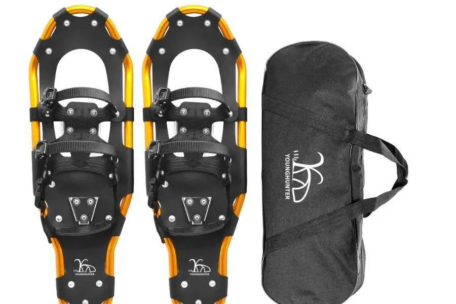 Kids’ snowshoes next to a carry bag