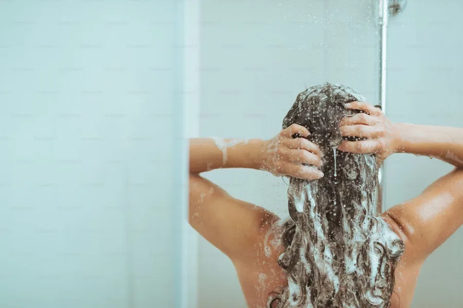 Lady washing her hair in the shower