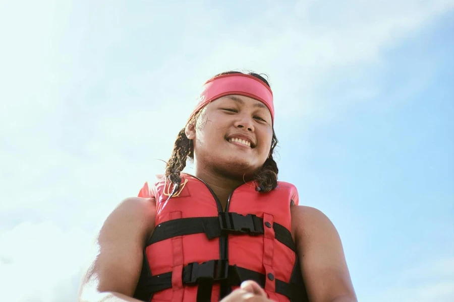 Lady wearing a red-colored life jacket