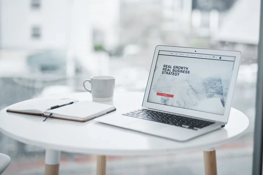 Laptop displaying a landing page on a table