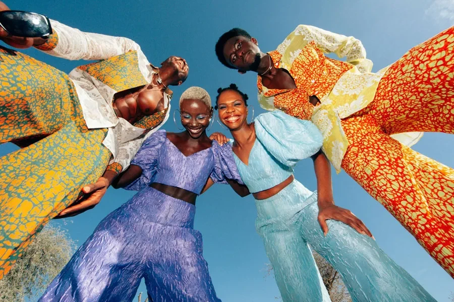 Low Angle View of Men and Women in Colorful Suits