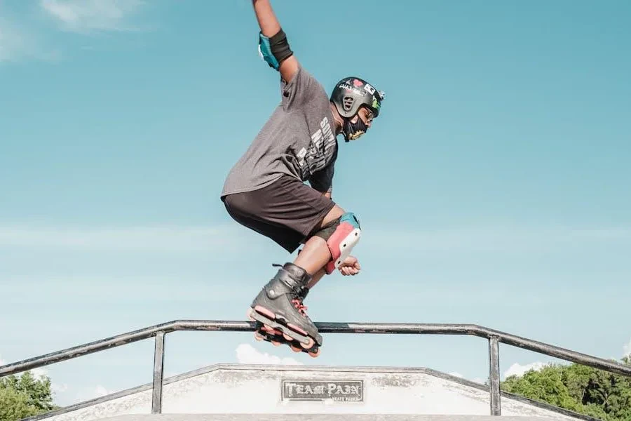 Man doing skating tricks with a helmet and other accessories