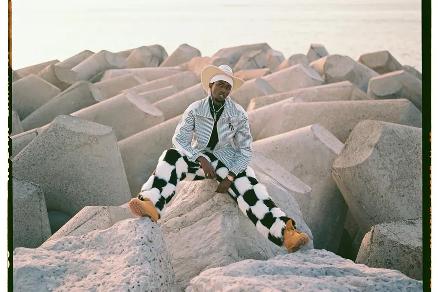 Man in Hat, Shirt and Checkered Trousers