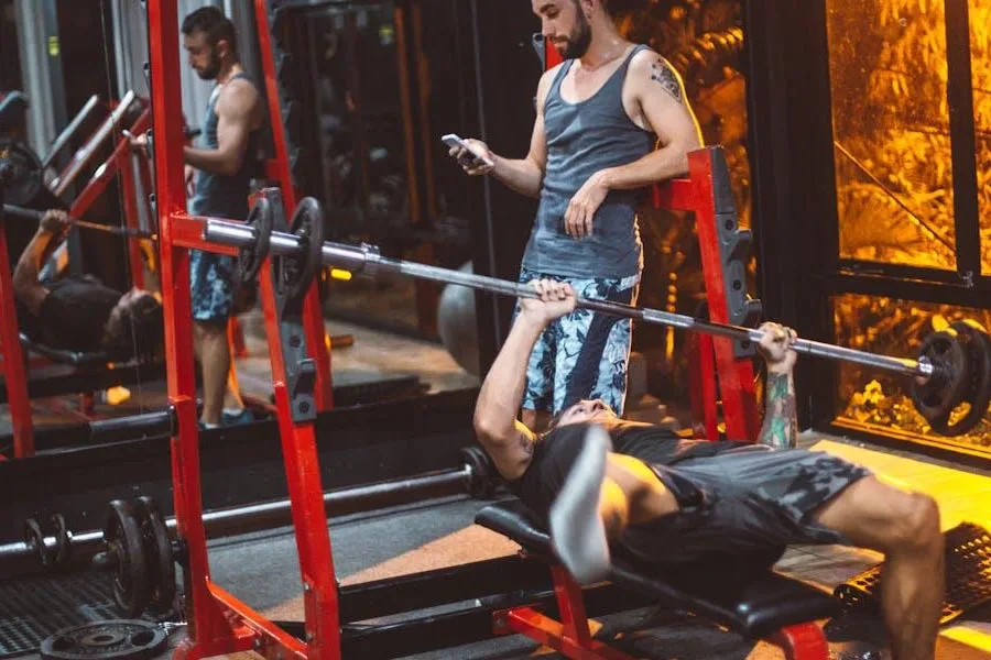 Man losing balance on a weight bench at a gym