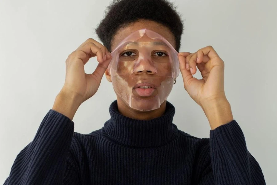 Man removing used chemical peel from his face