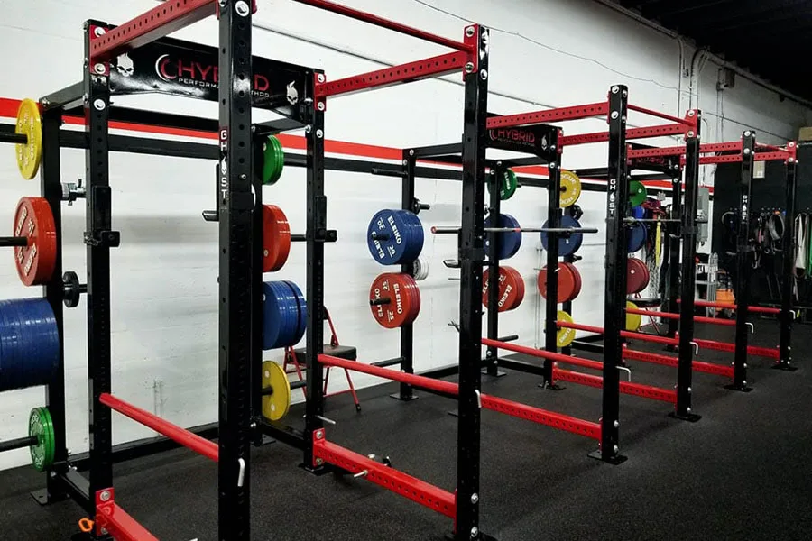 Multiple power racks stacked with weights