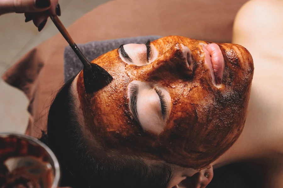 Person having a cacao facial treatment