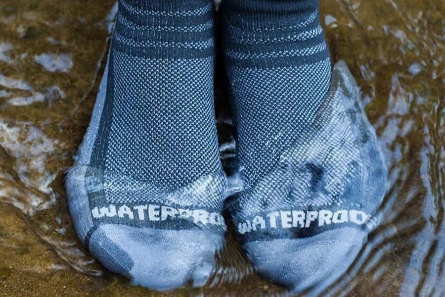 Person standing in water with water socks