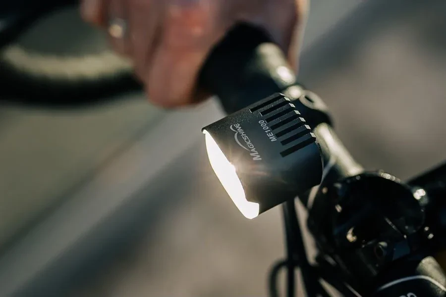 Person using an e-bike with a bright light