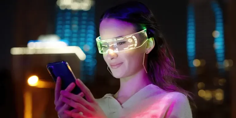 Person using smartphone and wearing AR glasses