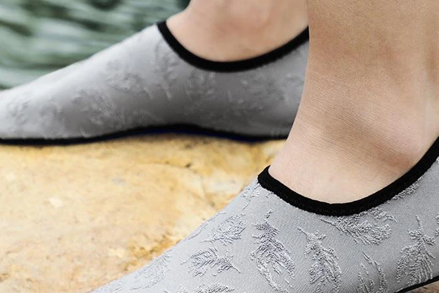 Person wearing a pair of gray water socks