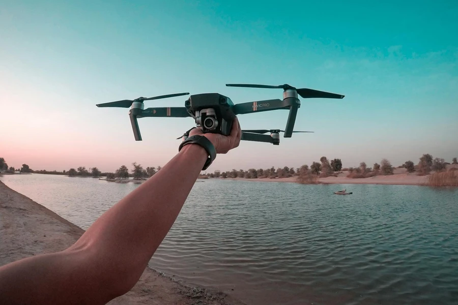 Photo of a person holding a drone (www.pexels.com)