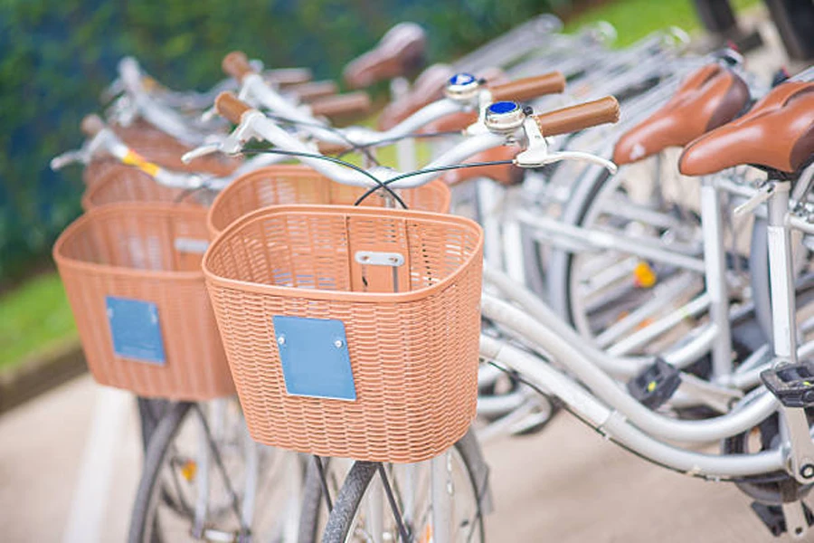 Row of traditional bikes with wicker bicycle baskets