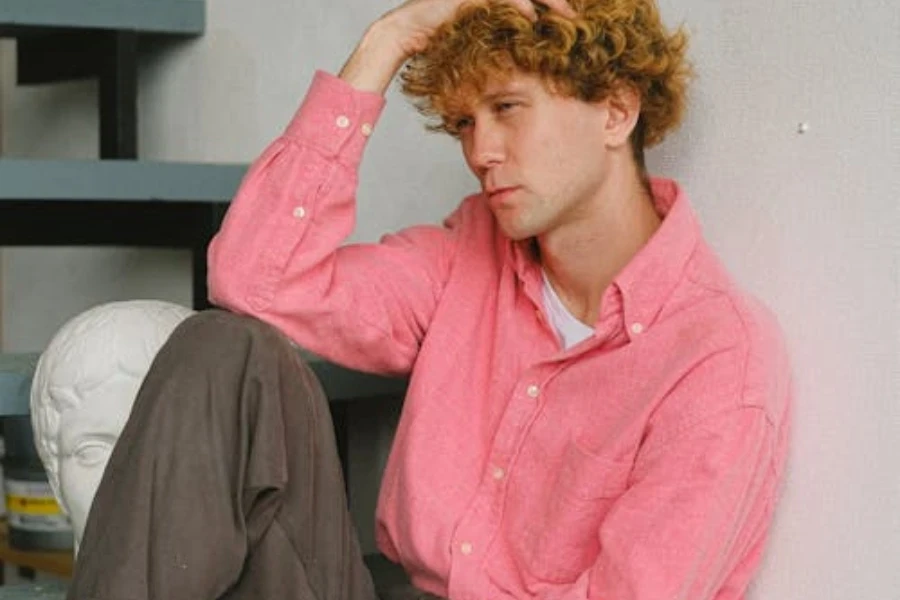 Serious man sitting on stairway