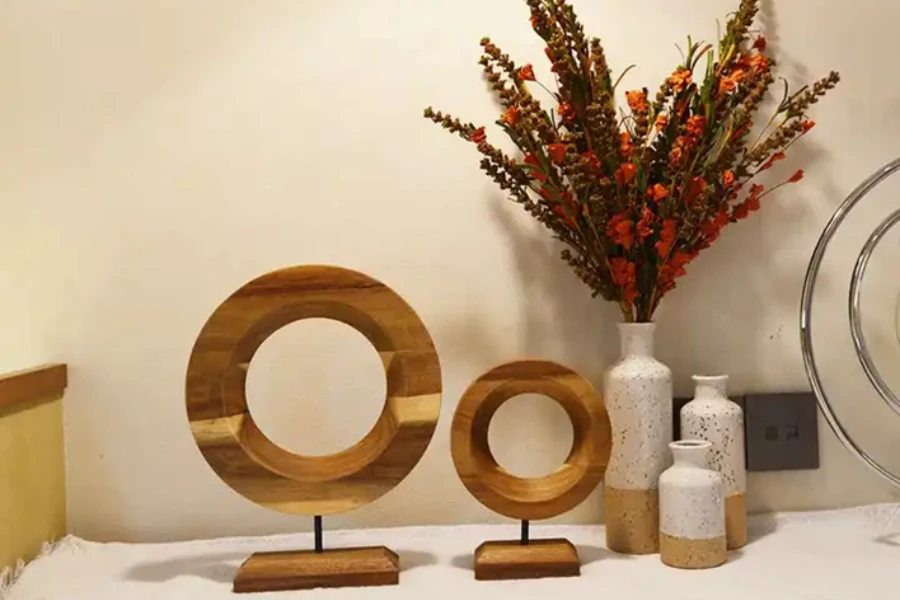 Small natural wood round décor items on rectangular pedestals