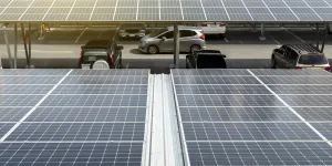 Solar Panel Photovoltaic installation on a Roof of car parking lot