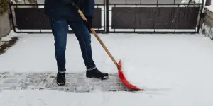 Someone shoveling snow with a snow shovel