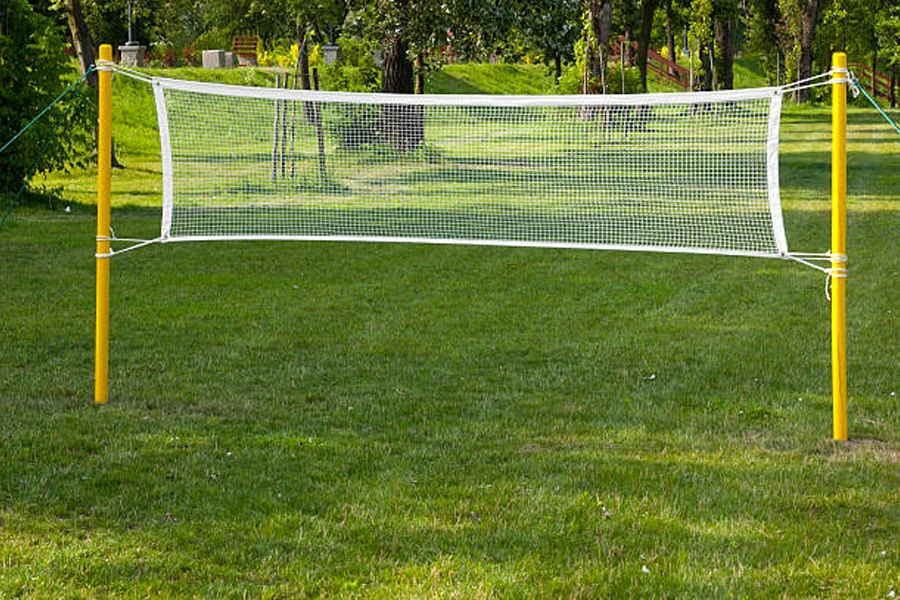 Sturdy outdoor badminton net with yellow poles and white net