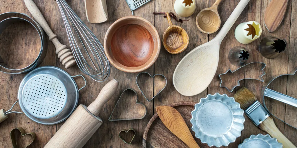 Table filled with different pie baking tools