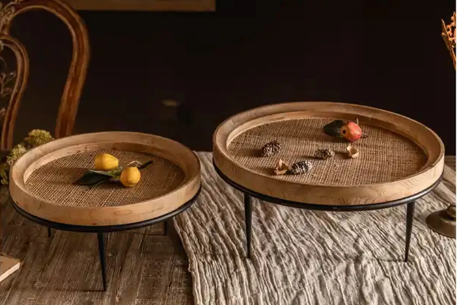 Two low profile decorative wooden trays on metal stands