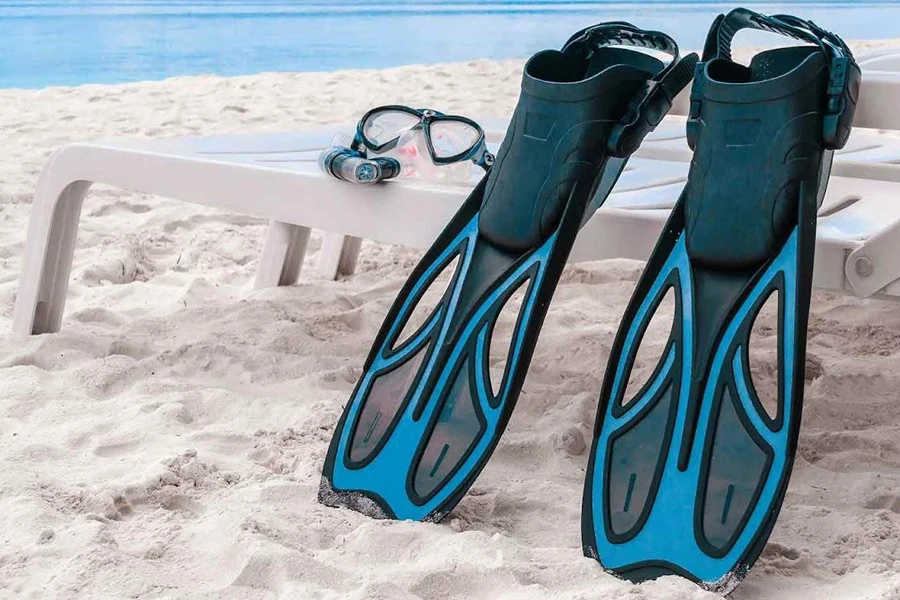 Two stylish fins on a beach