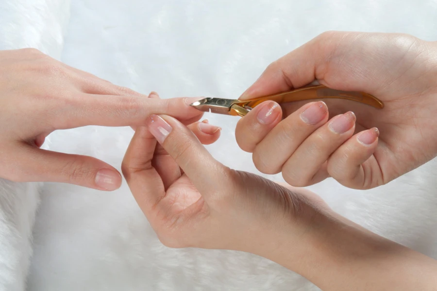 Users’ nails getting fixed with cuticle clipper