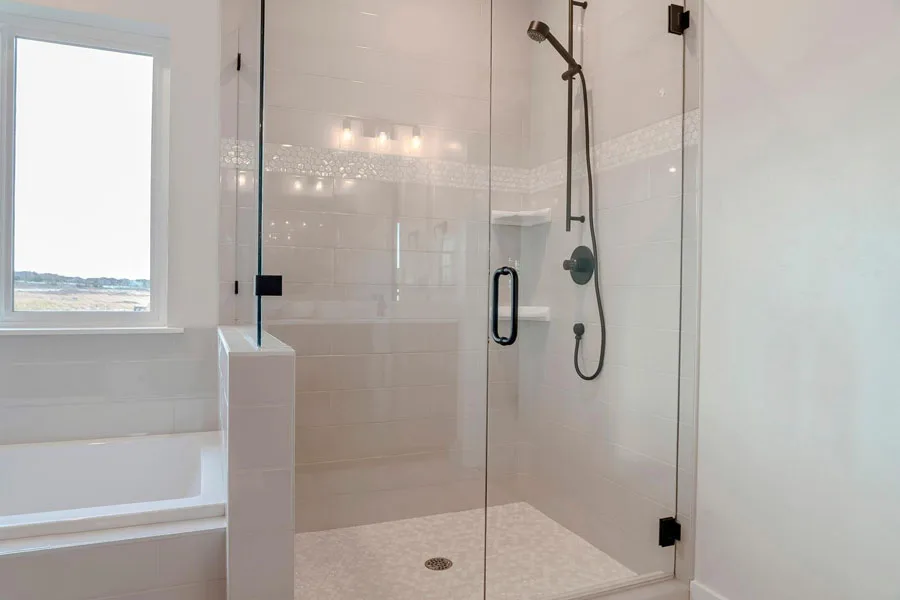 White corner shower caddy in an enclosed shower