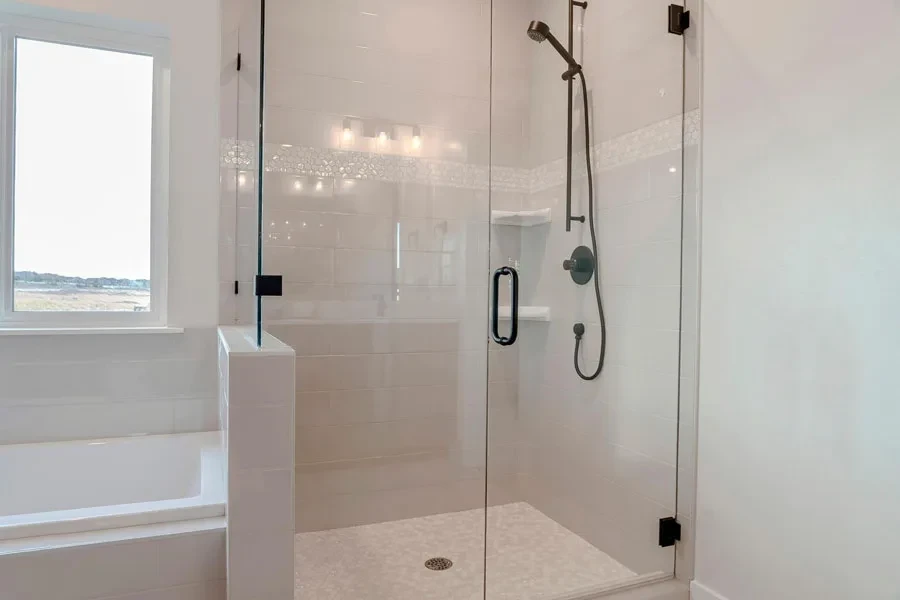 White corner shower caddy in an enclosed shower