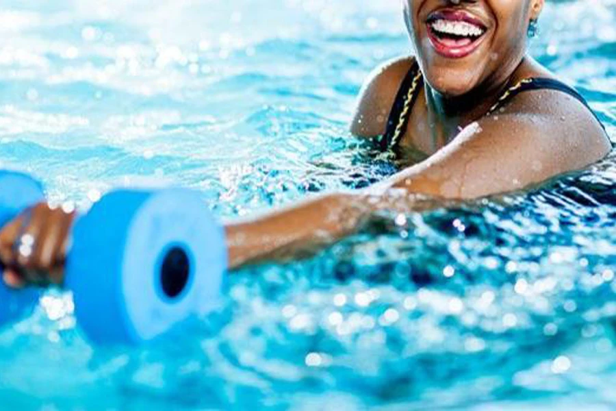 Woman exercising with an aqua dumbbell