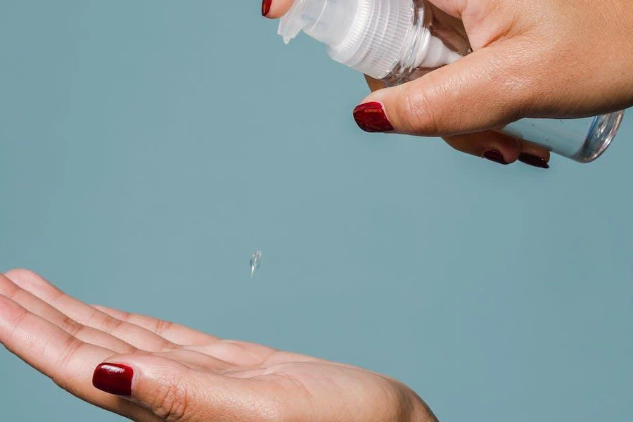 Woman putting some blackhead remover serum on her hands