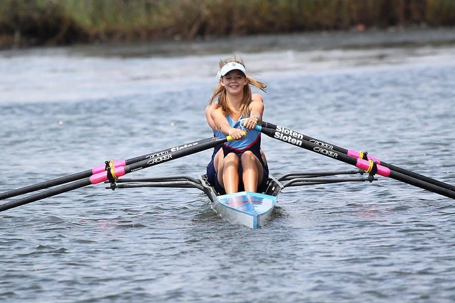 Woman using a rowing boat by herself