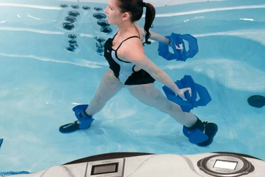 Woman using water ankle weights and other equipment