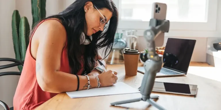 Woman writing points after a live broadcast