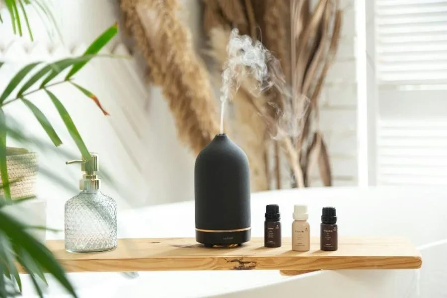 Wood bath tray with black aromatherapy diffuser